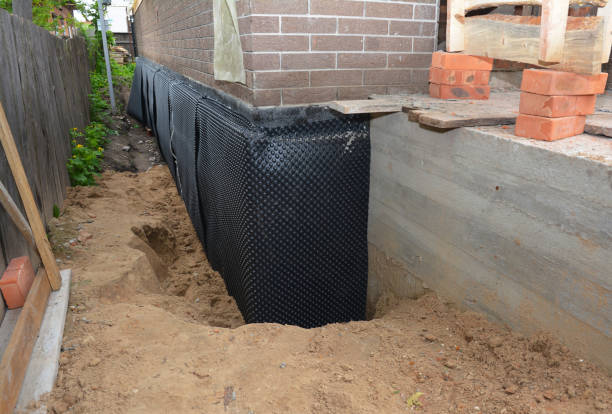 Happy homeowners after waterproofing job in West New York
